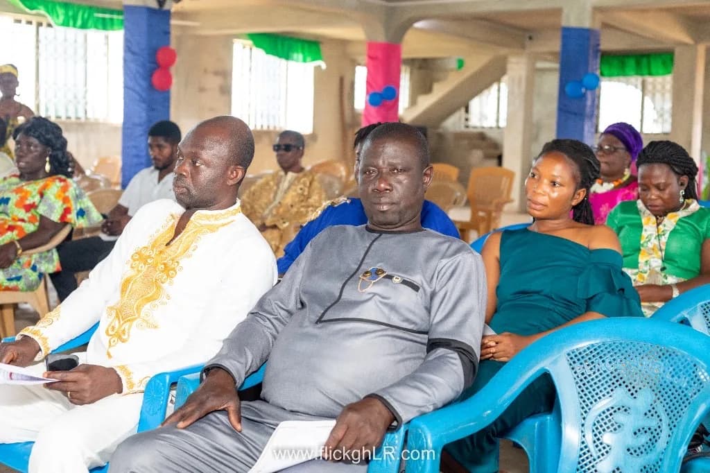 Congregants and community leaders seated at a formal gathering.