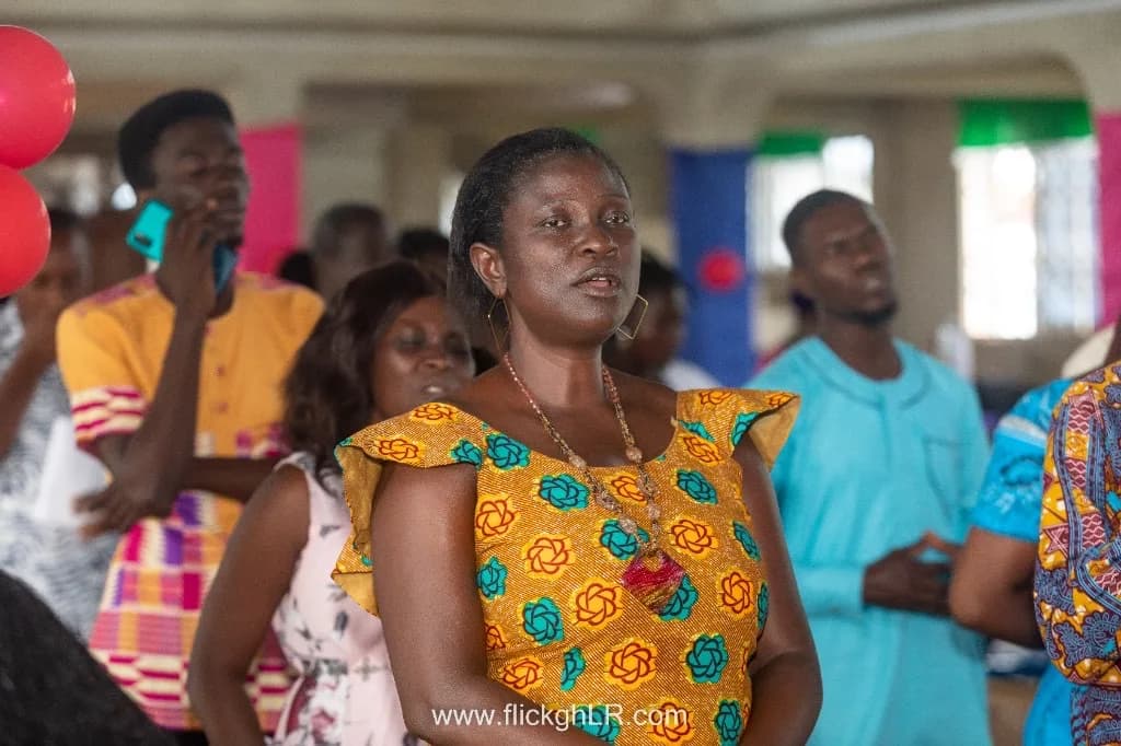 A congregant engaged in worship and fellowship at a community event.