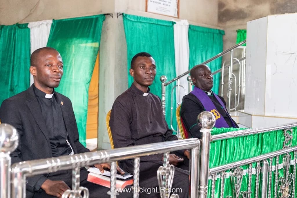 Clergy seated in leadership during a formal church ceremony.