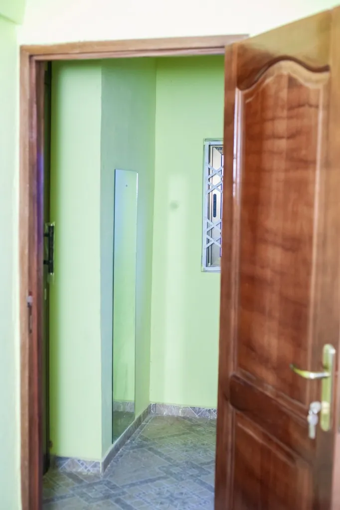 Interior finishing of a church facility, including doors and tiling.